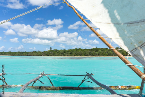Boat trip on a traditional caledonian sailing boat in Upi bay, Isle of pines, New Caledonia. turquoise sea and blue sky