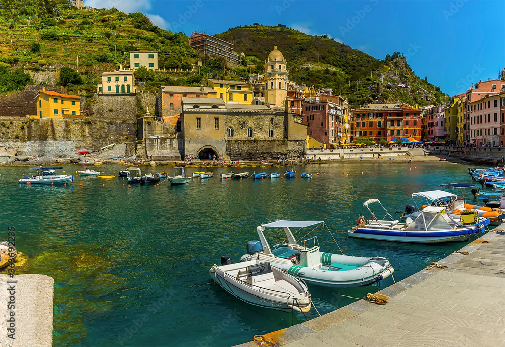 A panorama view across the harbour and the picturesque village of Vernazza in the summertime