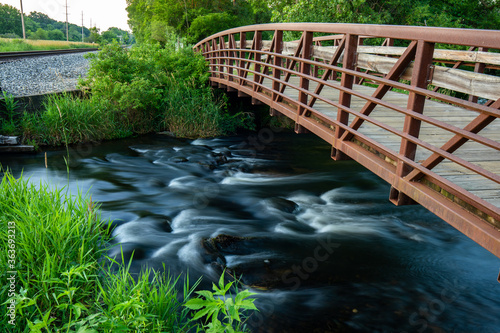 фотографія bridge over creek at portage creek bicentennial park in Michigan