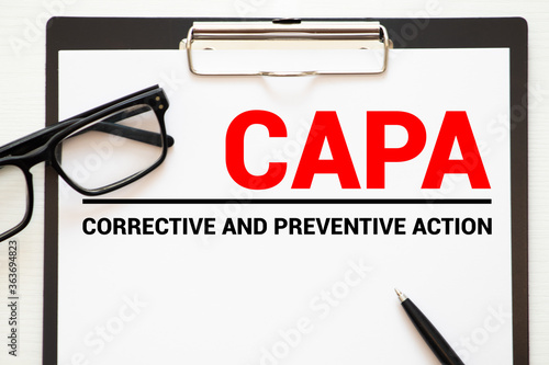 Obraz na plátne Paper with words CAPA Corrective and Preventive action plans