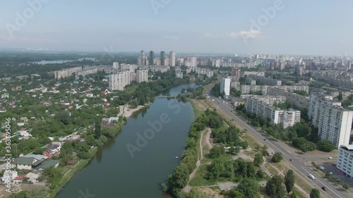 Wallpaper Mural View to big city from sky. Tiny townhouses and modern skyscrapers divided by the lake. Aerial drone footage. Torontodigital.ca