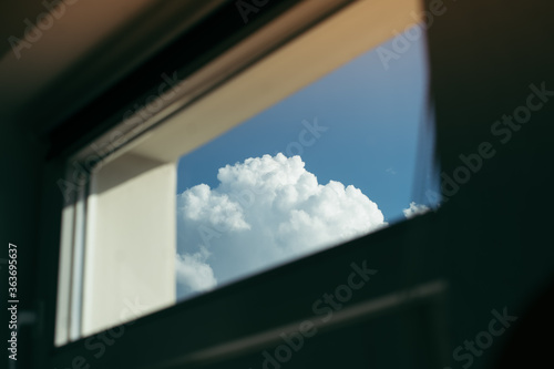 window view of high cumulonimbus clouds