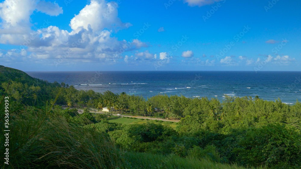 Naklejka premium Few cars drive along the coastal road leading around the island of Barbados