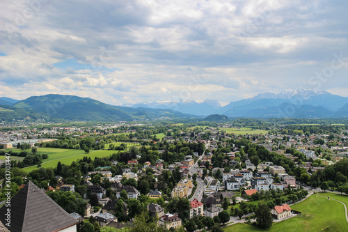 Cityscape. View of the city of Salzburd in Austria and Alps. Panorama of the city from above.