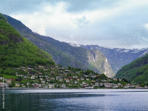 Beautiful landscape. View on mountains and small town in Norway fjord.