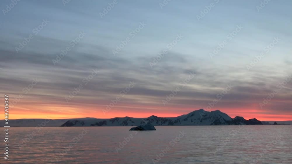 Dramatic Sunset and Sunrise in Antarctica - Antarctic Peninsula - Palmer Archipelago Dramatic Sunset and Sunrise in Antarctica - Antarctic Peninsula - Palmer Archipelago