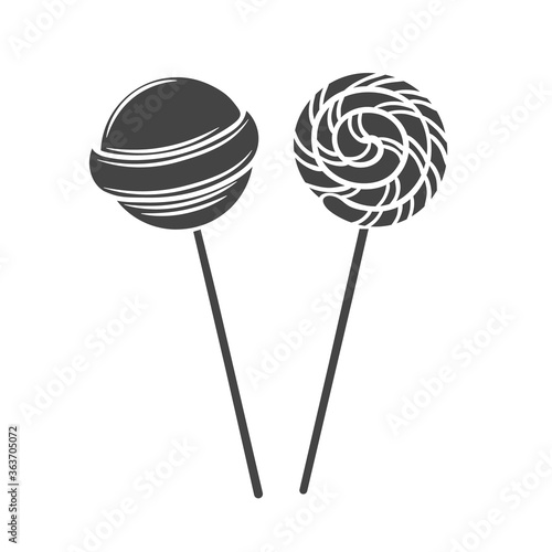 Lollipop candy on stick with twisted design glyph badge. Retro style. Vector illustration.