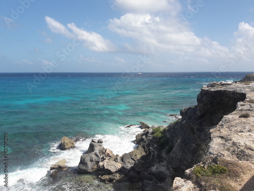 Isla Mujeres South Point Cancun Mexico blue water crashing against rocky shores 2020 © CURTIS
