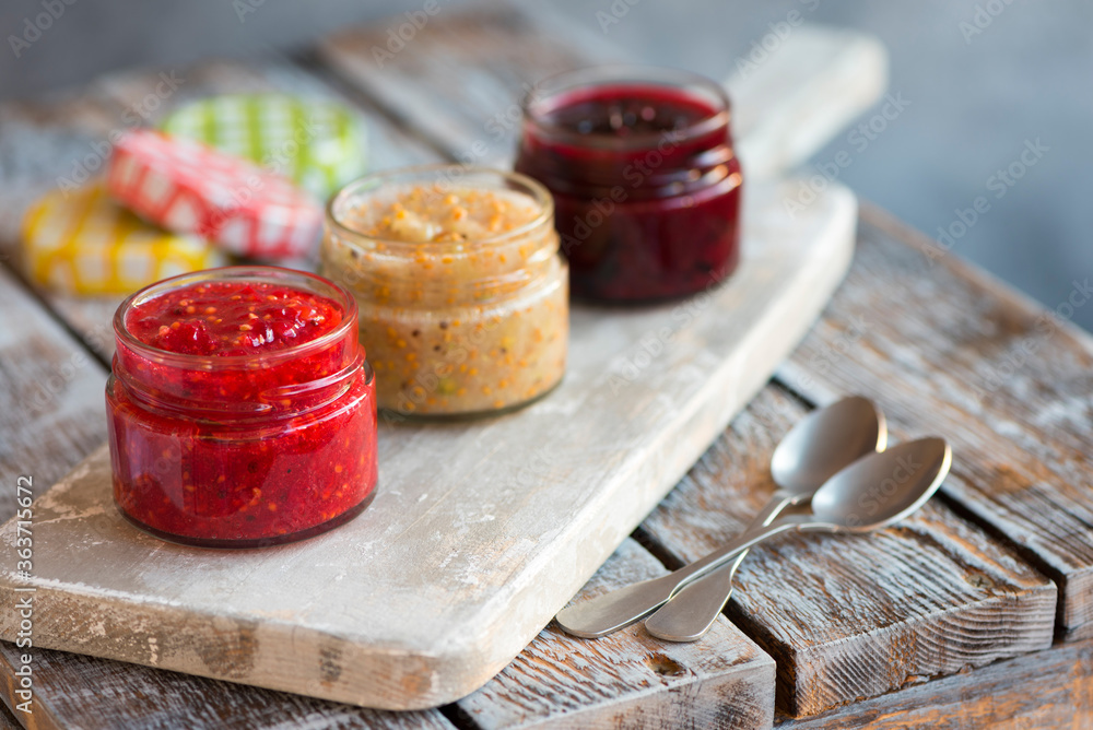 jars of black, red and yellow currant jam