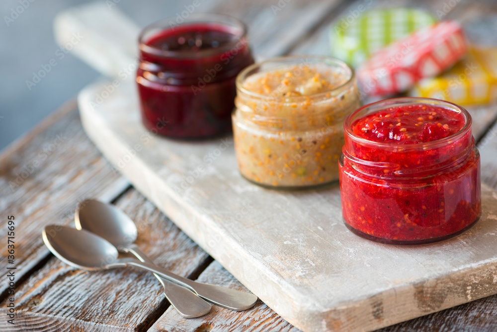 jars of black, red and yellow currant jam