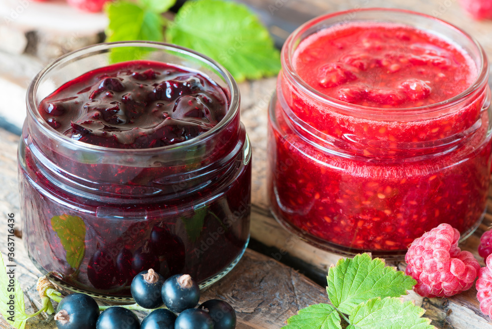 raspberry and currant jam in small jars