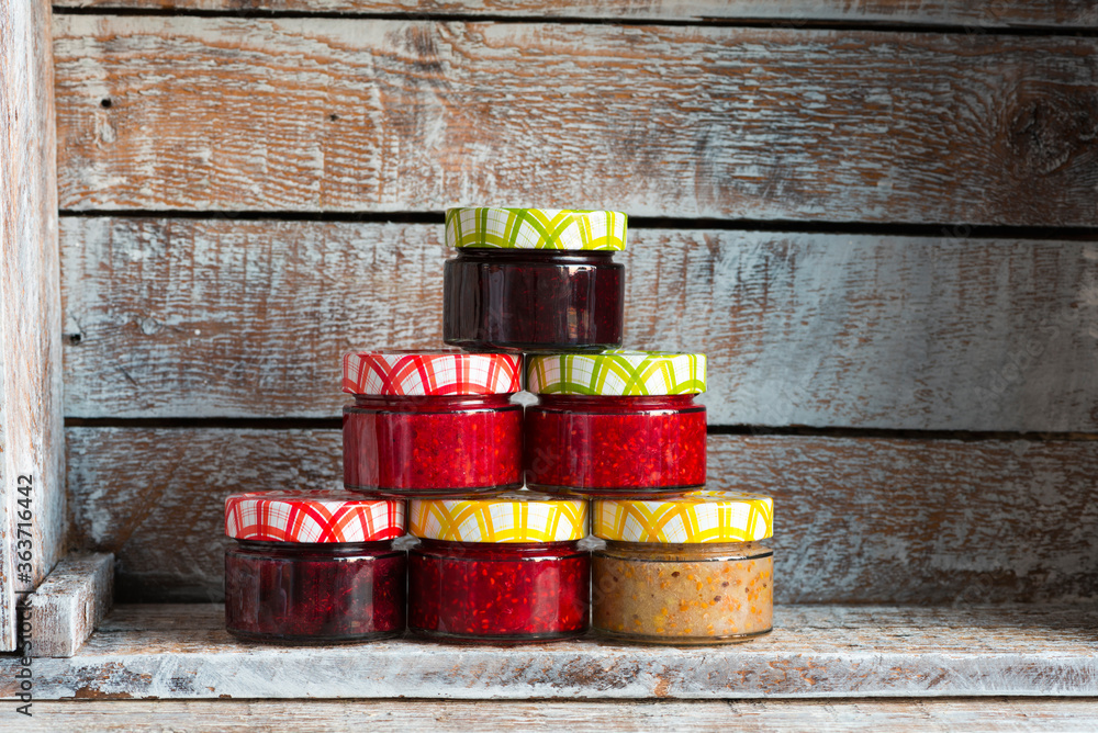 raspberry and currant jam in small jars