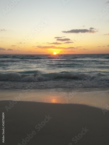 Fototapeta Naklejka Na Ścianę i Meble -  Sunrise over the beach and ocean in Cancun Mexico 2019