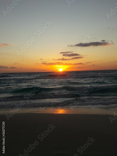Sunrise over the beach and ocean in Cancun Mexico 2019 © CURTIS