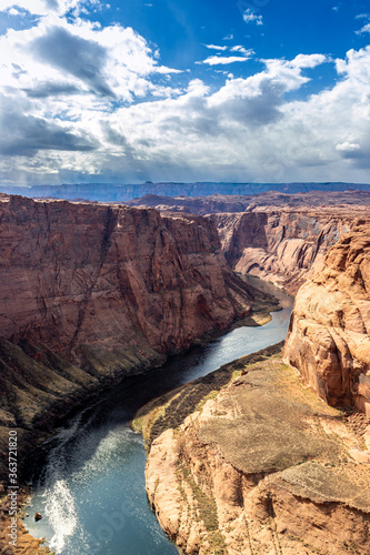 Clouds coming down with rain at a distance, Horseshoe bend, Page, AZ