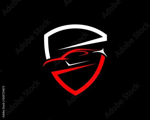 Red and white shield with car inside
