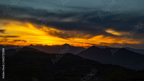 Sunset over desert mountain range © Alexander