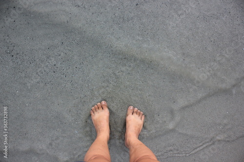 Woman feet on the beach at Thailand