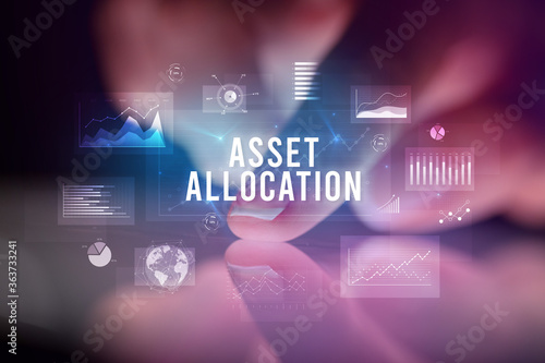 Finger touching tablet with charts and ASSET ALLOCATION inscription, business concept