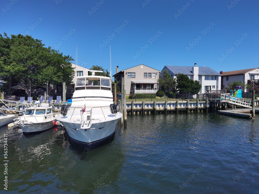 boats in the harbor, waterfront property with boat