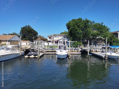 boats in the harbor, waterfront property with boat © Sarowar