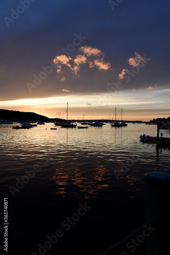 Harbor sunset with boats photo