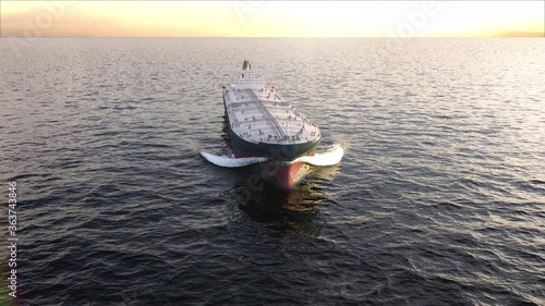 Large oil tanker (ship) with sailing in the ocean - aerial top view 3d animation