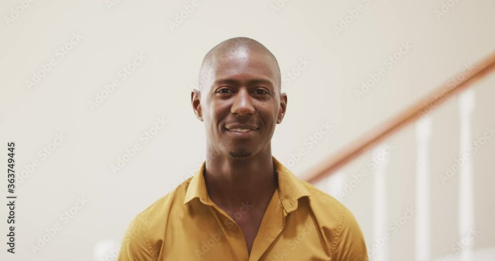 Young man smiling at home Young man smiling at home