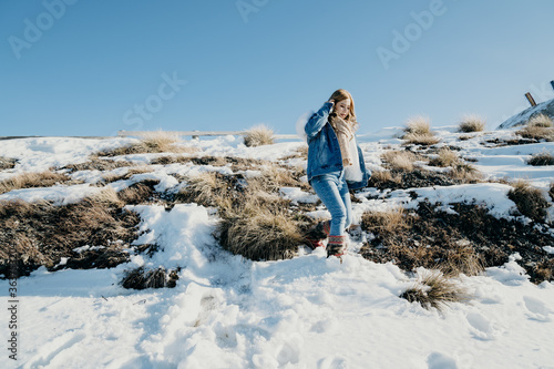Beautiful asian woman enjoy view with snow during winter in New Zealand.