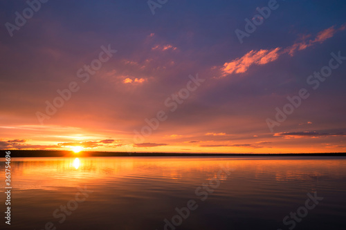 Abstract background colors fire in the sky summer sunset over sea © Olonkho