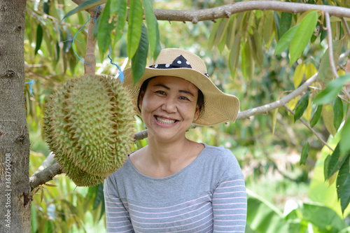young woman in a durian garden