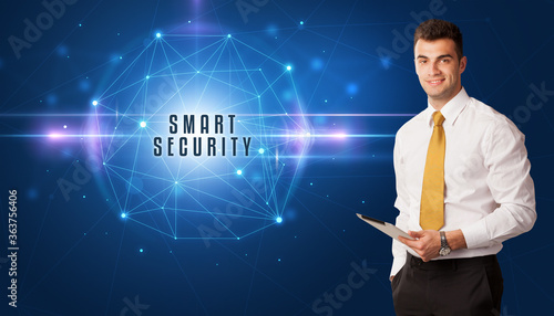 Businessman thinking about security solutions with SMART SECURITY inscription