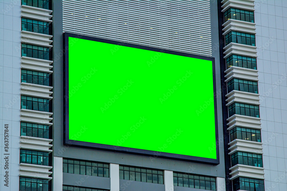 billboard blank on the skyscraper, copy space on green screen billboard blank on the skyscraper, copy space on green screen