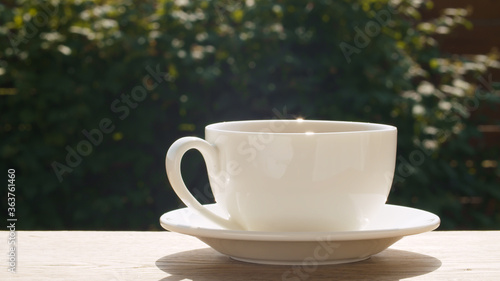 Teacup on the table in the garden