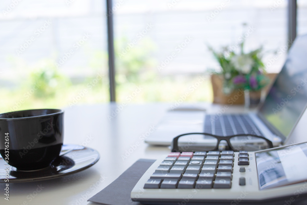 top viweAccounting equipment is placed on the desk in the house to reduce meeting people according to work-at-home measures. top viweAccounting equipment is placed on the desk in the house to reduce meeting people according to work-at-home measures.
