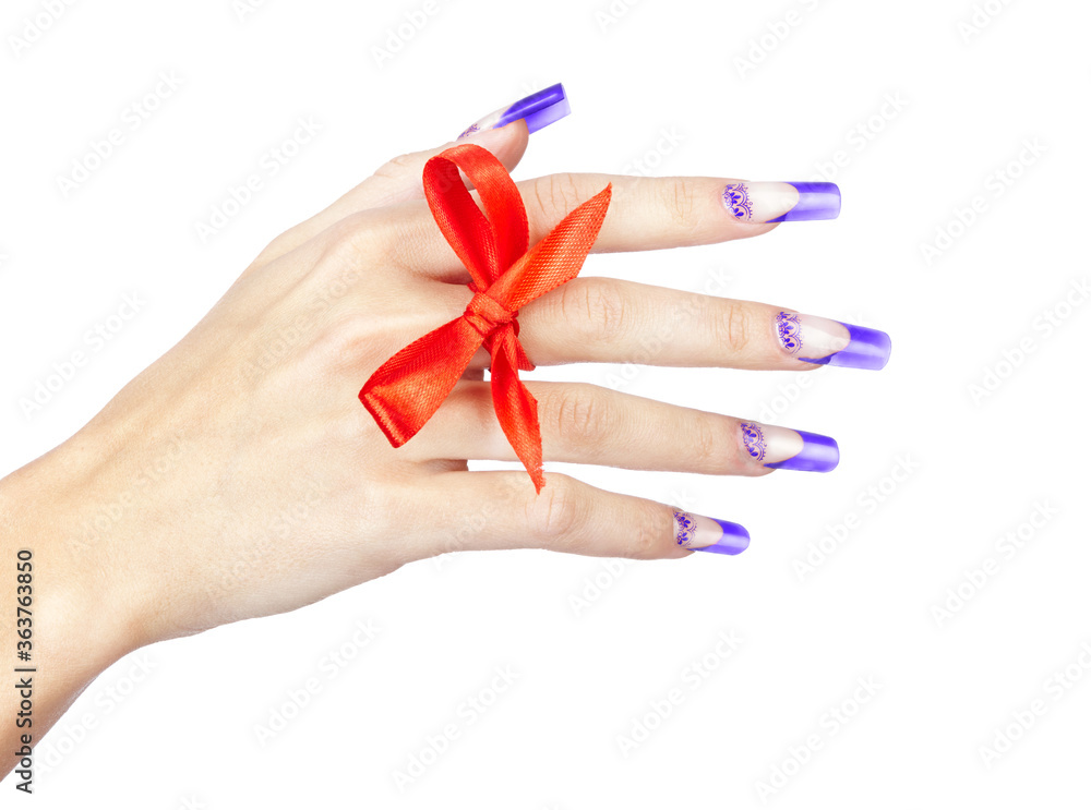 Hand with blue french acrylic nails manicure and painting with bow on finger Hand with blue french acrylic nails manicure and painting with bow on finger