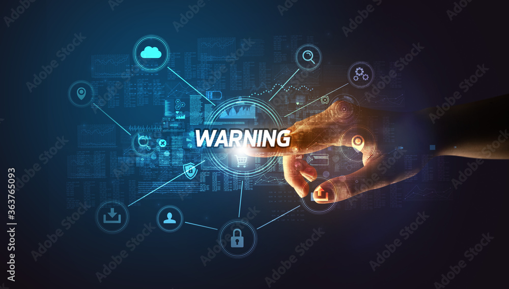 Hand touching WARNING inscription, Cybersecurity concept Hand touching WARNING inscription, Cybersecurity concept