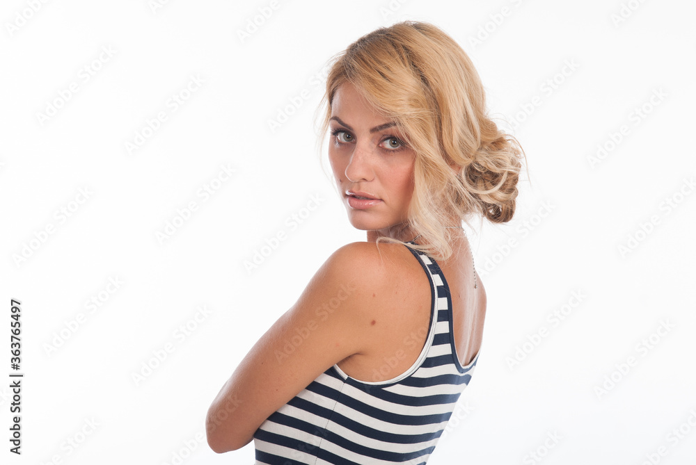 Closeup portrait of a beautiful young girl in a striped T-shirt isolated over a white Closeup portrait of a beautiful young girl in a striped T-shirt isolated over a white