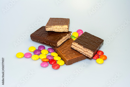 colorful chocolate candies, cookies and chocolate table photo