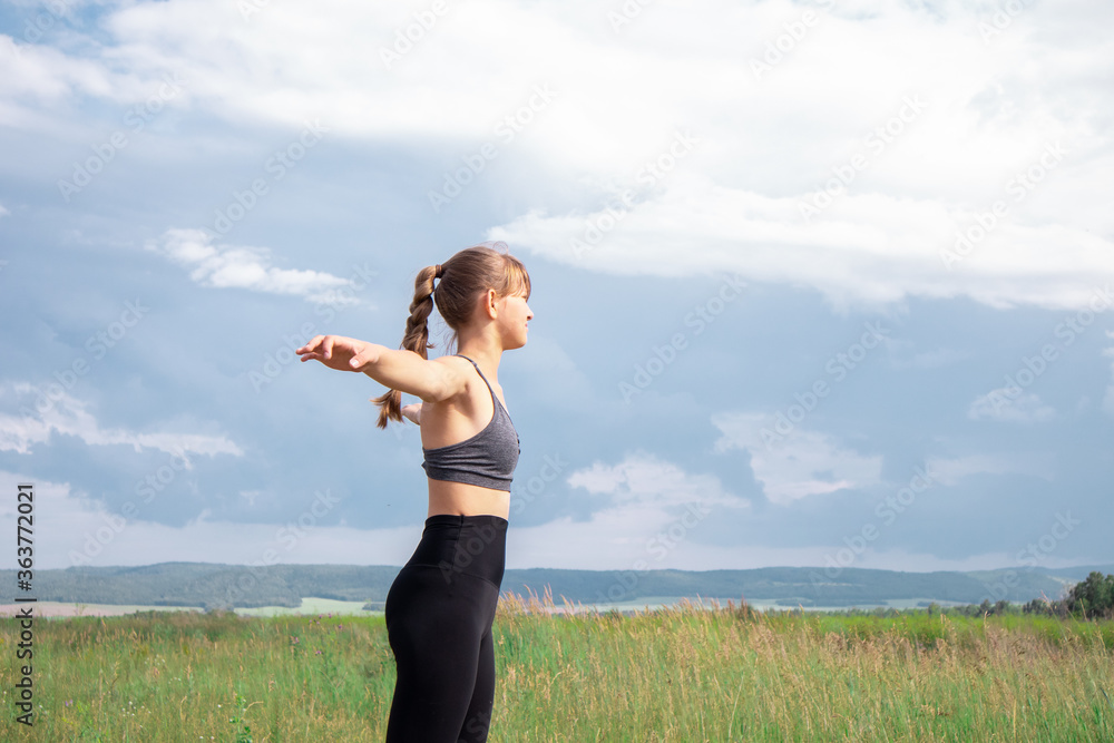 Girl doing sport outdoors. Doing exercises and workout Girl doing sport outdoors. Doing exercises and workout