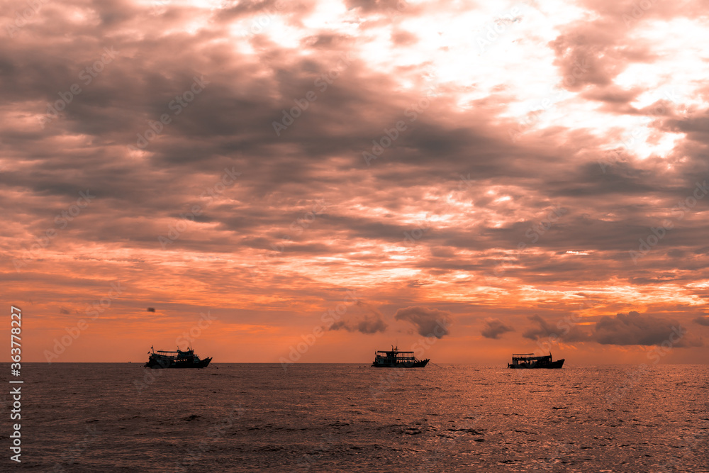 fishing boat at sunset