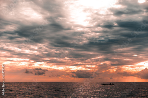sunset over the sea © ArdichawatSripaiboo