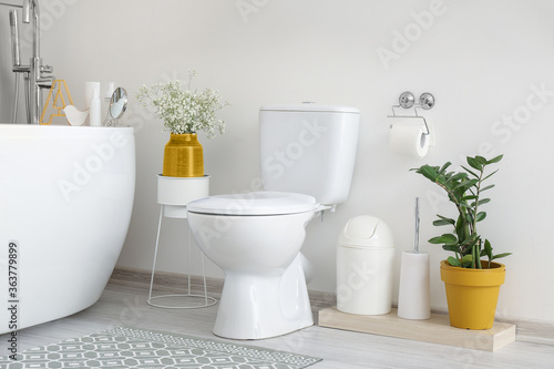 Interior of bathroom with floral decor