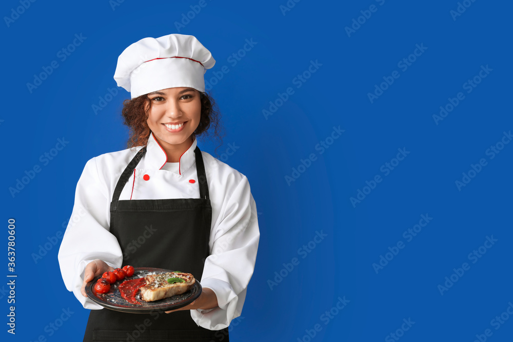 Female African-American chef with tasty dish on color background Female African-American chef with tasty dish on color background
