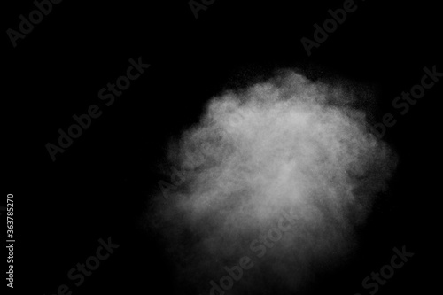 Abstract white steam, smoke in the form of a cloud on a black background, copy space