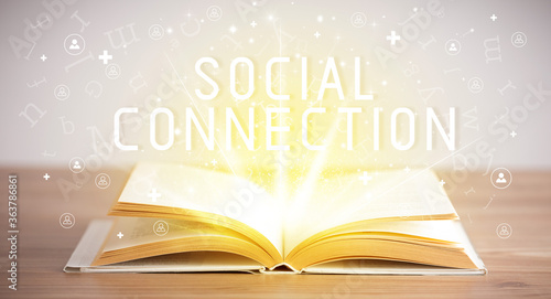 Open book with SOCIAL CONNECTION inscription, social media concept