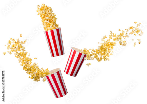 Set of flying popcorn from paper striped buckets isolated on white background