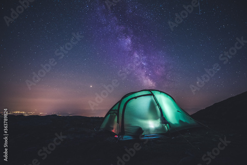 Sunset in High Tatras mountains national park. Mountain in Slovakia. Image contains noise due to high ISO and selective focus. Night sky. milky way at campsite, kemping