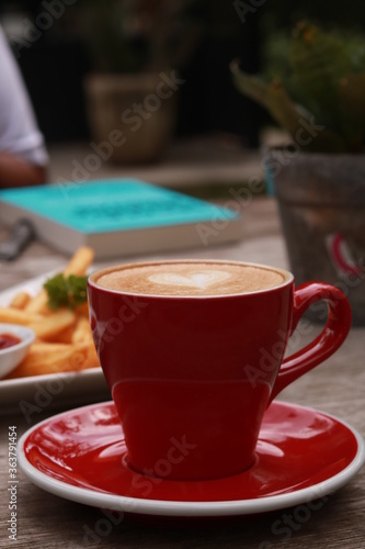 coffe latte cup on a wood table.