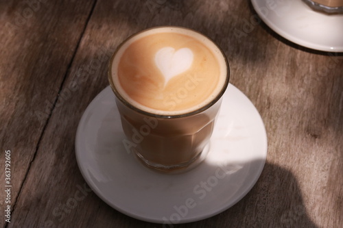 coffe latte cup on a wood table.